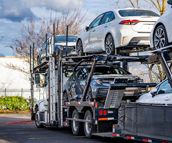 The Benefits Of Enclosed Vs. Open  Auto Transport: Which Is Right For  Your Car?